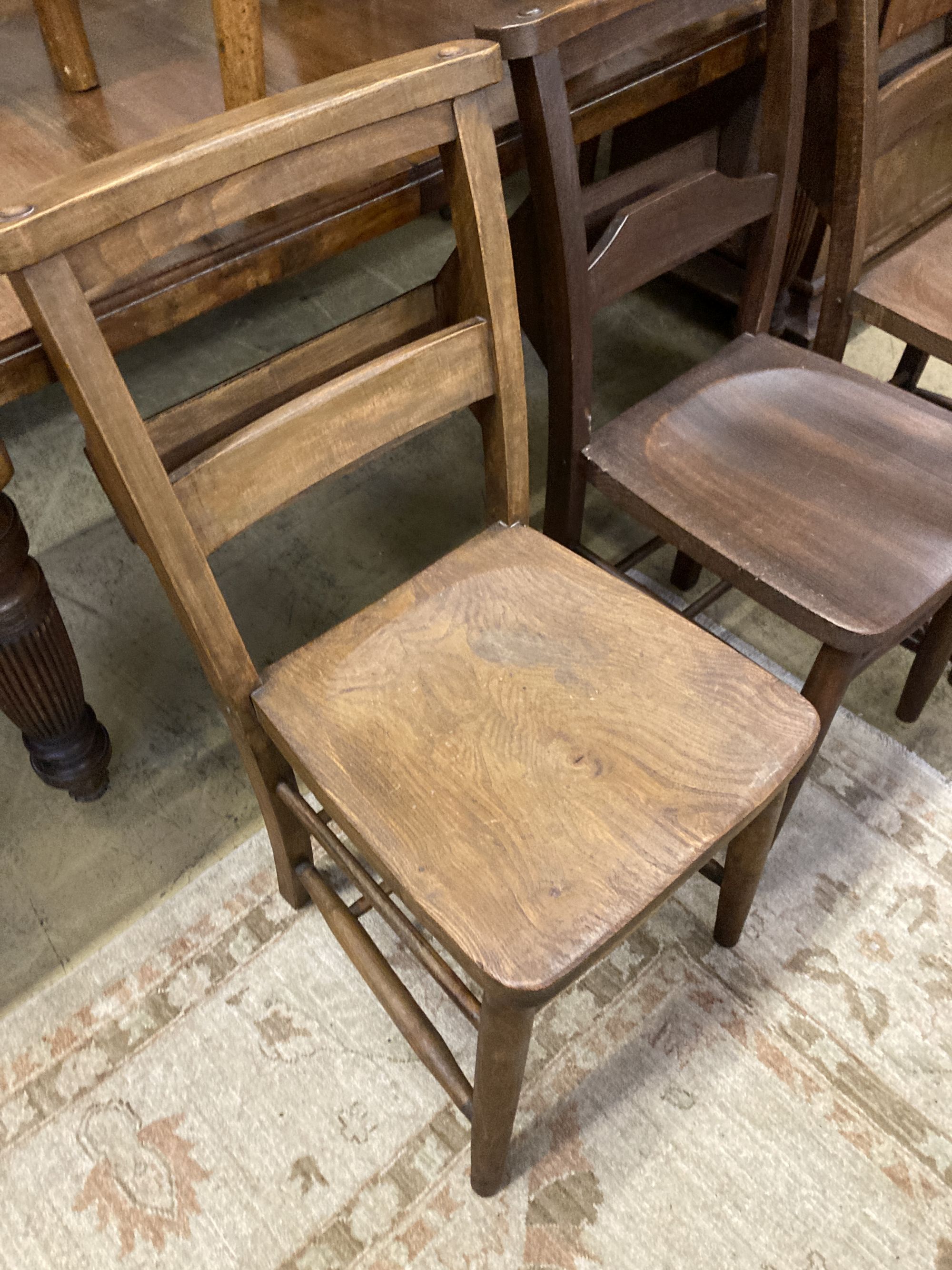 Seven Victorian elm and beech chapel chairs